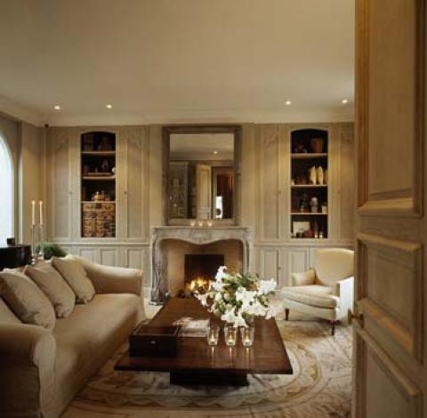 Traditional Family Room with french style fire place mantel