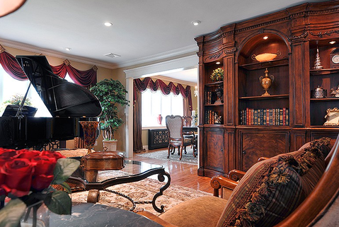 Traditional Living Room with custom wood bookshelf