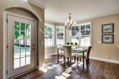Transitional Dining Room with wide plank hardwood floors