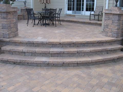 Traditional Patio with cement ledger stone pillars