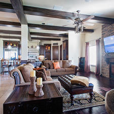 Traditional Family Room with beige stacked stone faced fireplace