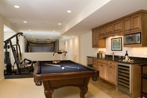 Traditional Basement with black felt top on pool table