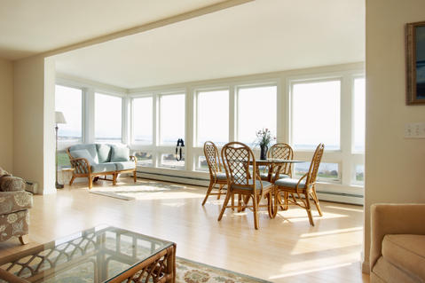 Contemporary Sunroom with glass top dining table