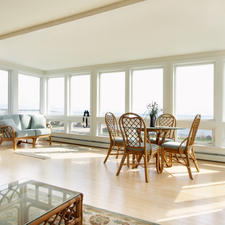 Contemporary Sunroom with glass top dining table