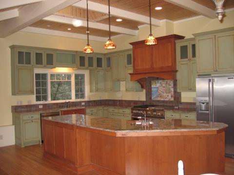Eclectic Kitchen with stained wood cabinets on island