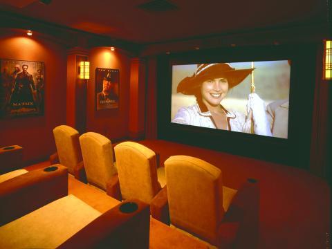 Traditional Home Theater with large wall hung projector screen