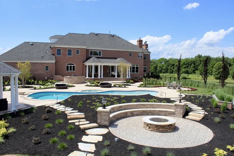 Modern Pool with gray limestone fireplace