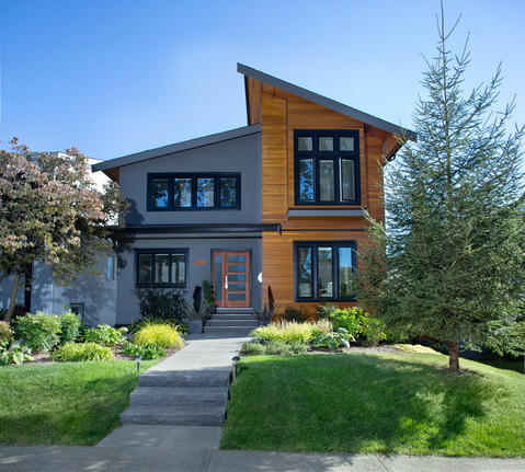 Contemporary Home Exterior with frosted glass panels in entryway door