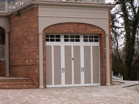 Transitional Garage with cobblestone sidewalk