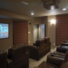 Traditional Home Theater with red brocade wall paper wall detail
