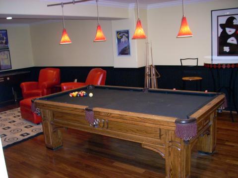 Eclectic Basement with light yellow painted walls