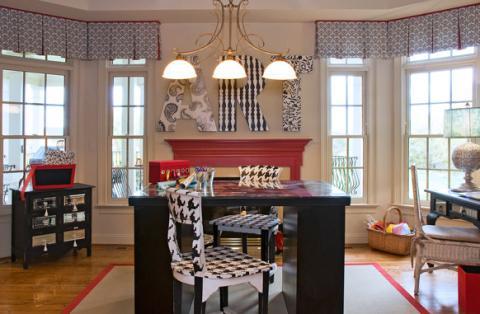 Eclectic Home Office with black dresser with mirror drawers and tassel hardware