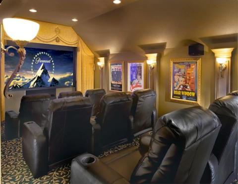 Traditional Home Theater with black leather recliner chairs