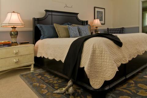 Traditional Bedroom with white faux painted bedside dresser