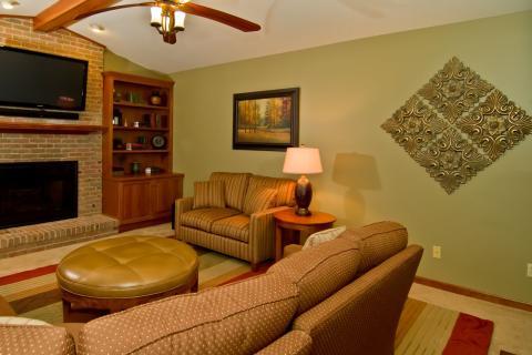 Contemporary Family Room with tufted leather ottoman