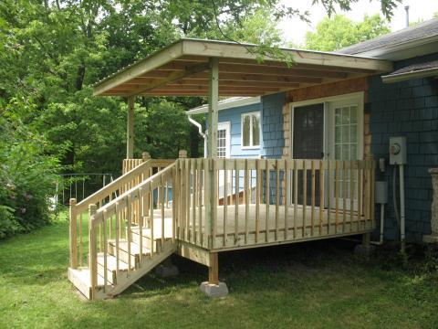 Traditional Deck with unfinished wood deck