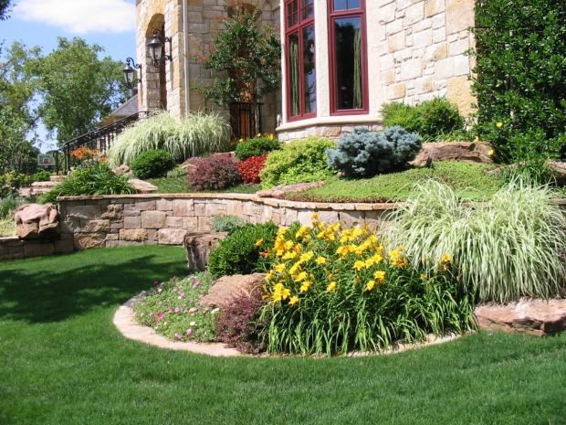Traditional Landscape with wrought iron stair railing