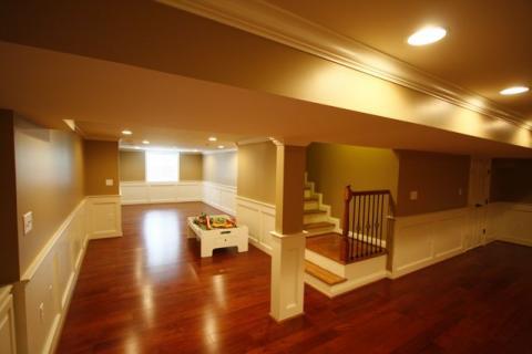 Traditional Basement with light brown painted walls