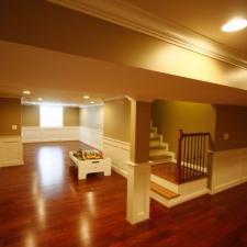Traditional Basement with light brown painted walls