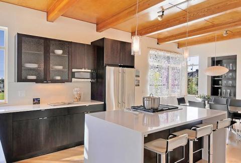 Modern Kitchen with metal and black dining table and chairs