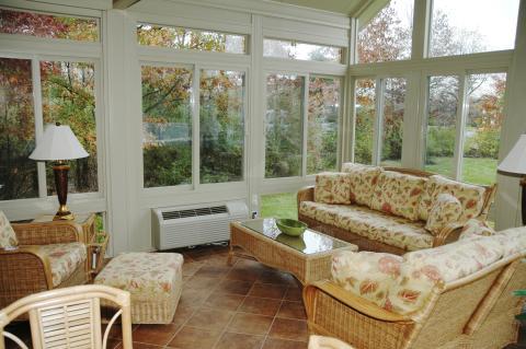 Traditional Sunroom with wicker furniture