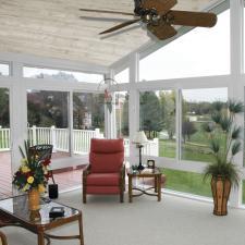 Traditional Sunroom with dark wood coffee table with glass top