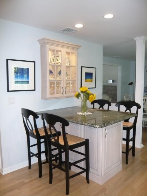 Traditional Dining Room with wood and rattan barstools