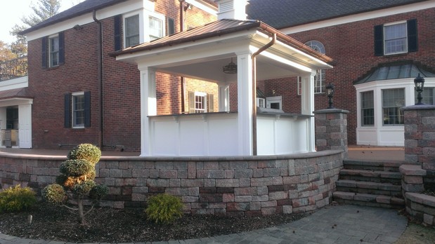 Traditional Outdoor Kitchen with black exterior shutters