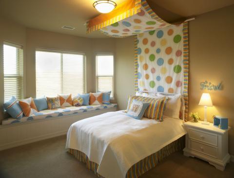 Cottage Kids Room with blue and orange throw pillows