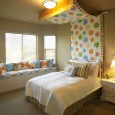 Cottage Kids Room with blue and orange throw pillows