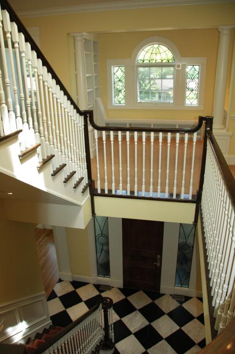 Traditional Entry with black and white marble tile checker flooring