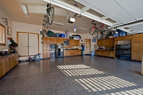Traditional Garage with double doors to storage