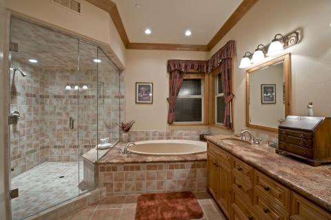 Traditional Bathroom with light tan tile shower wall covering