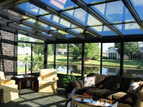 Transitional Sunroom with yellow reclining chairs