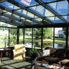 Transitional Sunroom with yellow reclining chairs