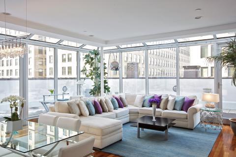 Contemporary Living Room with white cushioned armless dining chairs