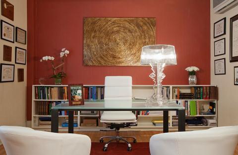 Eclectic Home Office with medium stained wood floor