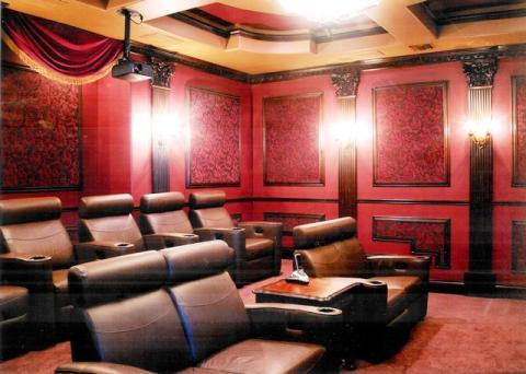 Traditional Home Theater with dark brown leather recliner chairs