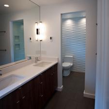 Contemporary Master Bathroom with dark wood vanity cabinet