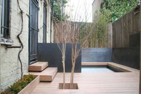 Modern Patio with gray stone house siding