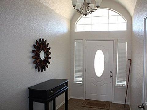 Traditional Entry with white windowed entry door