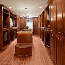Traditional Closet with brown granite counter tops