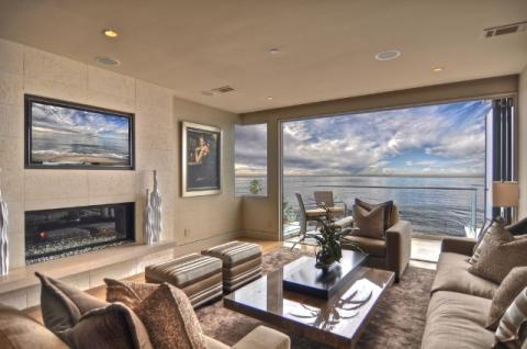 Contemporary Family Room with tan porcelain tile fire place facing