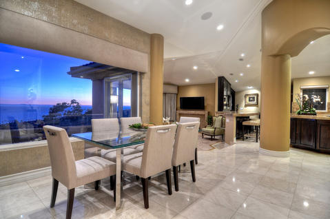 Transitional Dining Room with textured wallpaper