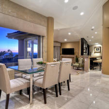 Transitional Dining Room with textured wallpaper