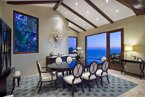 Transitional Dining Room with wall mirror with peacock frame design
