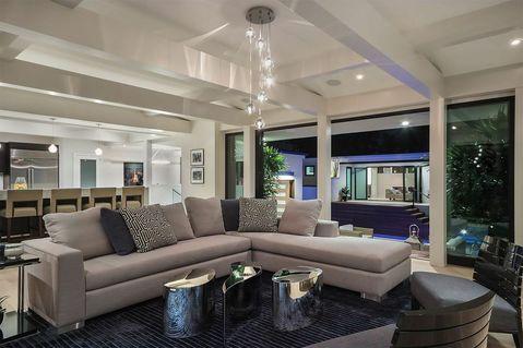 Contemporary Living Room with floor to ceiling window