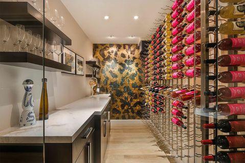 Contemporary Wine Cellar with gold textured accent wall