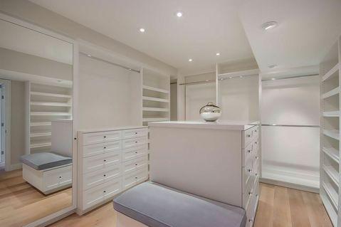 Contemporary Closet with light hardwood floor