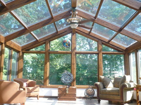 Traditional Sunroom with stained glass ceiling fan